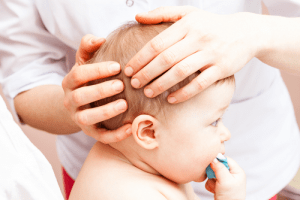 Baby head treating Bribie Osteopathy